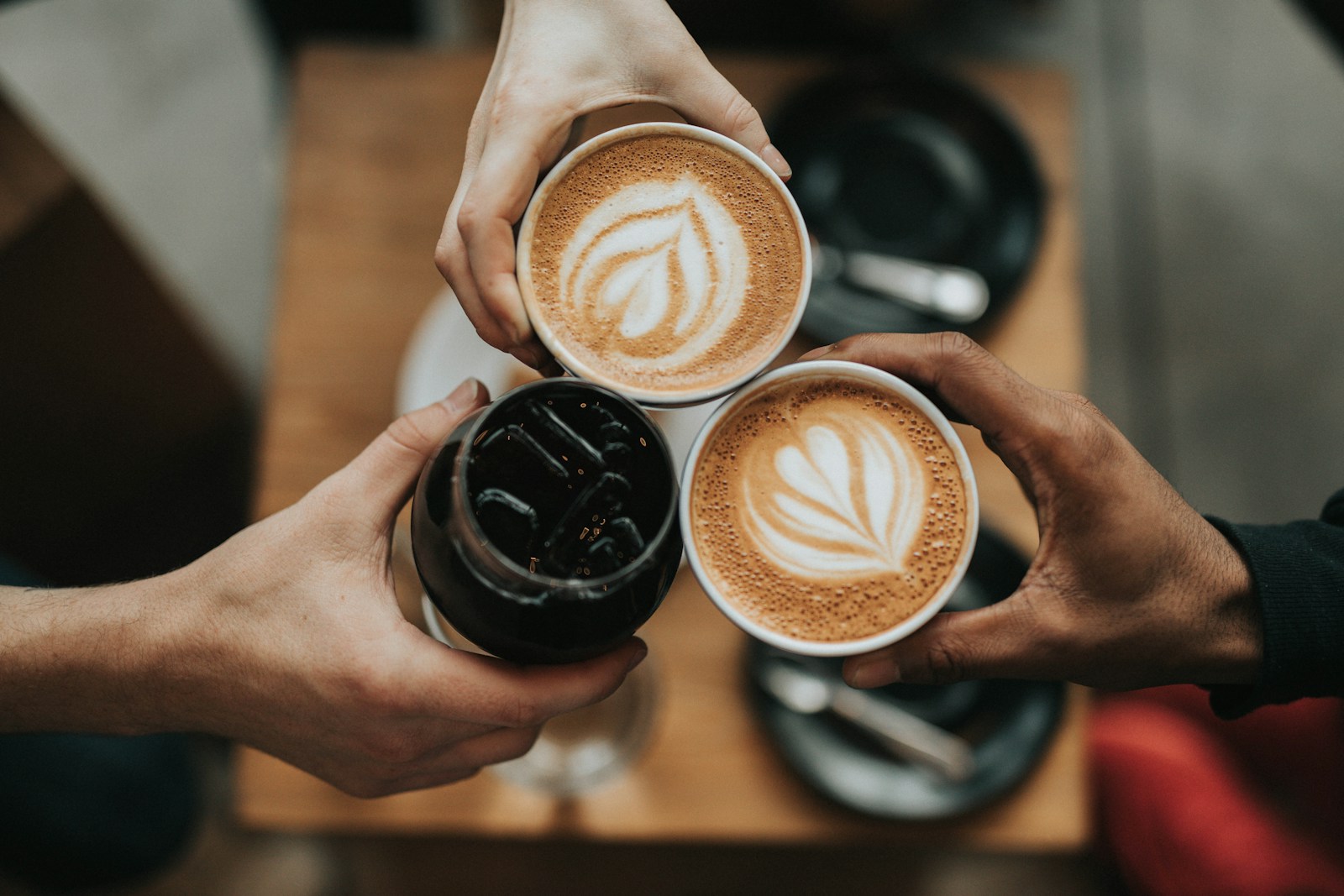 Latte with leaf art in a ceramic cup